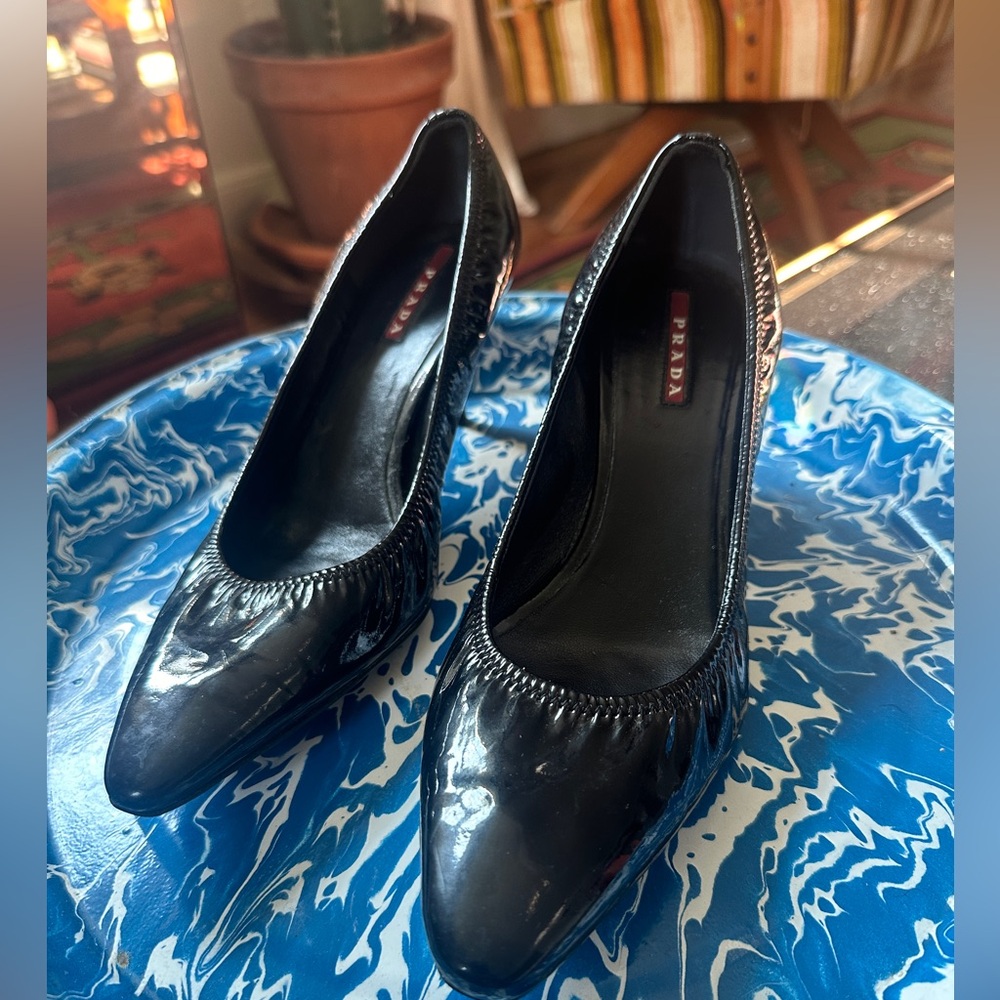 Patent leather Prada kitten heels. Some scuffing on the heel.